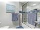 Bright bathroom featuring a glass shower, blue accents, and essential toiletries at 4857 N Granite Reef Rd, Scottsdale, AZ 85251