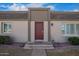 Close up view of a townhouse and its maroon front door and welcoming entryway at 4857 N Granite Reef Rd, Scottsdale, AZ 85251