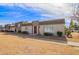 Delightful townhouse showcases tidy landscaping and a maroon front door with modern design at 4857 N Granite Reef Rd, Scottsdale, AZ 85251