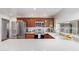 Bright kitchen with stainless steel appliances, wood cabinets, white countertops, and backyard view from the window at 4857 N Granite Reef Rd, Scottsdale, AZ 85251