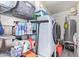 Laundry room with modern washer, dryer, and shelving filled with cleaning supplies at 4857 N Granite Reef Rd, Scottsdale, AZ 85251