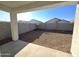 A large backyard includes a rock ground covering, a cinder block wall, and a covered patio at 4939 S 105Th Dr, Tolleson, AZ 85353