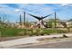 Community playground shaded by canvas structures featuring slides, soft ground covering, and grassy landscaping at 4939 S 105Th Dr, Tolleson, AZ 85353