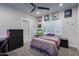 Bedroom featuring a ceiling fan, neutral walls and carpet, and personal touches on the wall at 5020 E Pershing Ave, Scottsdale, AZ 85254