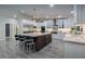 Bright, modern kitchen featuring a large island with seating, stainless steel appliances, and white cabinetry at 5020 E Pershing Ave, Scottsdale, AZ 85254