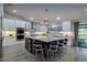 Modern kitchen with stainless steel appliances, a large island, and sleek white cabinetry at 5020 E Pershing Ave, Scottsdale, AZ 85254