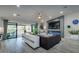 Stylish living room with a modern fireplace, sliding glass doors, and hardwood floors at 5020 E Pershing Ave, Scottsdale, AZ 85254