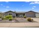 Charming single-story home showcasing a low maintenance front yard and attached two-car garage at 5061 E Edgewood Ave, Mesa, AZ 85206