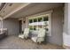 Inviting front porch with two chairs and a view of the front yard at 5061 E Edgewood Ave, Mesa, AZ 85206