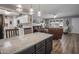 Modern open-concept kitchen featuring stainless steel appliances and a spacious island at 5061 E Edgewood Ave, Mesa, AZ 85206