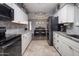 Bright kitchen featuring white cabinets and granite countertops at 5061 E Edgewood Ave, Mesa, AZ 85206