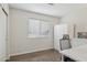 Bright bedroom with neutral paint, light wood floors, ample natural light, and large closet at 510 S Kenwood Ln, Chandler, AZ 85226