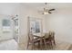 Bright dining area with vaulted ceiling and sliding glass doors to the backyard at 510 S Kenwood Ln, Chandler, AZ 85226