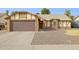 Charming single-story home with a brown garage door and low maintenance landscaping at 510 S Kenwood Ln, Chandler, AZ 85226