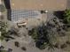 Overhead view of the backyard, featuring a covered patio with a grilling area, and beautiful desert landscaping at 5450 N Globe Dr, Eloy, AZ 85131