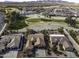 Beautiful aerial view features homes with a golf course in the background and desert landscape at 5450 N Globe Dr, Eloy, AZ 85131