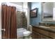 Stylish bathroom with granite countertop and decorative shower curtain at 5450 N Globe Dr, Eloy, AZ 85131