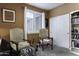 Cozy bedroom featuring natural light from the window, closet space, and bookshelves at 5450 N Globe Dr, Eloy, AZ 85131