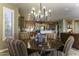 Dining room featuring a stylish chandelier and large windows, with views extending to the kitchen and living room at 5450 N Globe Dr, Eloy, AZ 85131