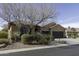 Charming single-story home featuring a three-car garage, desert landscaping and flag at 5450 N Globe Dr, Eloy, AZ 85131