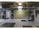 Well-organized garage with epoxy floors, plenty of storage, and a dedicated workspace at 5450 N Globe Dr, Eloy, AZ 85131