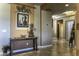 Hallway with entry table, art, and lighting leading to other rooms in the house at 5450 N Globe Dr, Eloy, AZ 85131