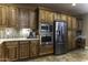 Kitchen area showcasing wood cabinets, granite counters, tile backsplash, and stainless steel appliances at 5450 N Globe Dr, Eloy, AZ 85131