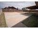 Backyard with a large concrete patio area and a covered patio at 5608 W Greenbriar Dr, Glendale, AZ 85308