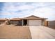 Charming single-story brick home featuring a two-car garage and low maintenance desert landscaping at 5608 W Greenbriar Dr, Glendale, AZ 85308