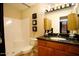 Well-lit bathroom featuring a vanity with granite countertop and a clean, tiled shower stall at 5877 N Granite Reef Rd # 2243, Scottsdale, AZ 85250