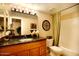 A well-lit bathroom with a shower-tub combination, framed mirror, and decorative accents at 5877 N Granite Reef Rd # 2243, Scottsdale, AZ 85250