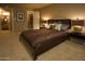 Comfortable bedroom with a plush bed, neutral decor, and convenient access to a walk-in closet at 5877 N Granite Reef Rd # 2243, Scottsdale, AZ 85250