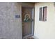 Charming front door with wreath and address number at 5877 N Granite Reef Rd # 2243, Scottsdale, AZ 85250