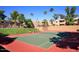 Well-maintained tennis court, surrounded by green grass and shade trees, perfect for active living at 5877 N Granite Reef Rd # 2243, Scottsdale, AZ 85250