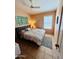 Cozy bedroom with ceiling fan, natural lighting, and neutral decor for a relaxing ambiance at 6458 W Adobe Dr, Glendale, AZ 85308