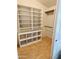 Walk-in closet with open shelving and hanging space, offering ample storage at 6458 W Adobe Dr, Glendale, AZ 85308