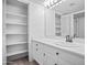 Well-lit bathroom showcasing a vanity with storage, and an illuminated mirror at 7161 E Mcdonald E Dr # 2, Paradise Valley, AZ 85253