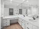 Bathroom with dual sinks, white cabinets, and walk-in shower at 7161 E Mcdonald E Dr # 2, Paradise Valley, AZ 85253