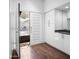 Bright entryway with wood floors, white cabinets, and security door at 7161 E Mcdonald E Dr # 2, Paradise Valley, AZ 85253