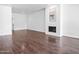 Open living room featuring wood flooring, fireplace and light-filled atmosphere at 7161 E Mcdonald E Dr # 2, Paradise Valley, AZ 85253