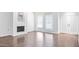 Spacious living room with fireplace, light walls, and wood flooring at 7161 E Mcdonald E Dr # 2, Paradise Valley, AZ 85253