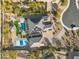 Aerial view of a home, featuring a swimming pool, pickleball court, solar panels and desert landscaping at 7662 W Artemisa Ave, Peoria, AZ 85383