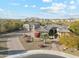 Beautiful aerial view of a desert home featuring lush landscaping, a circular driveway, and a detached garage at 7662 W Artemisa Ave, Peoria, AZ 85383