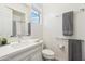 Well-lit bathroom with a vanity, modern sink fixtures, and a large mirror at 7662 W Artemisa Ave, Peoria, AZ 85383