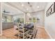 Elegant dining room with stylish furniture, hardwood floors, and recessed lighting at 7662 W Artemisa Ave, Peoria, AZ 85383