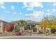 Inviting home exterior with desert landscaping, solar panels, and a neatly maintained front yard at 7662 W Artemisa Ave, Peoria, AZ 85383