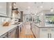 Modern kitchen with stainless steel appliances, subway tile backsplash, and wood flooring at 7662 W Artemisa Ave, Peoria, AZ 85383