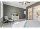 Serene main bedroom with soft carpet, neutral walls, closet, and comfortable chair at 7662 W Artemisa Ave, Peoria, AZ 85383