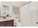 Well-lit bathroom featuring a shower and vanity at 7717 W Noble Prairie Way, Florence, AZ 85132