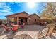 Beautiful backyard featuring multiple seating areas, patio and stunning desert landscaping at 7946 W Sonoma Way, Florence, AZ 85132